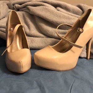 Tan Mary Jane platform pumps